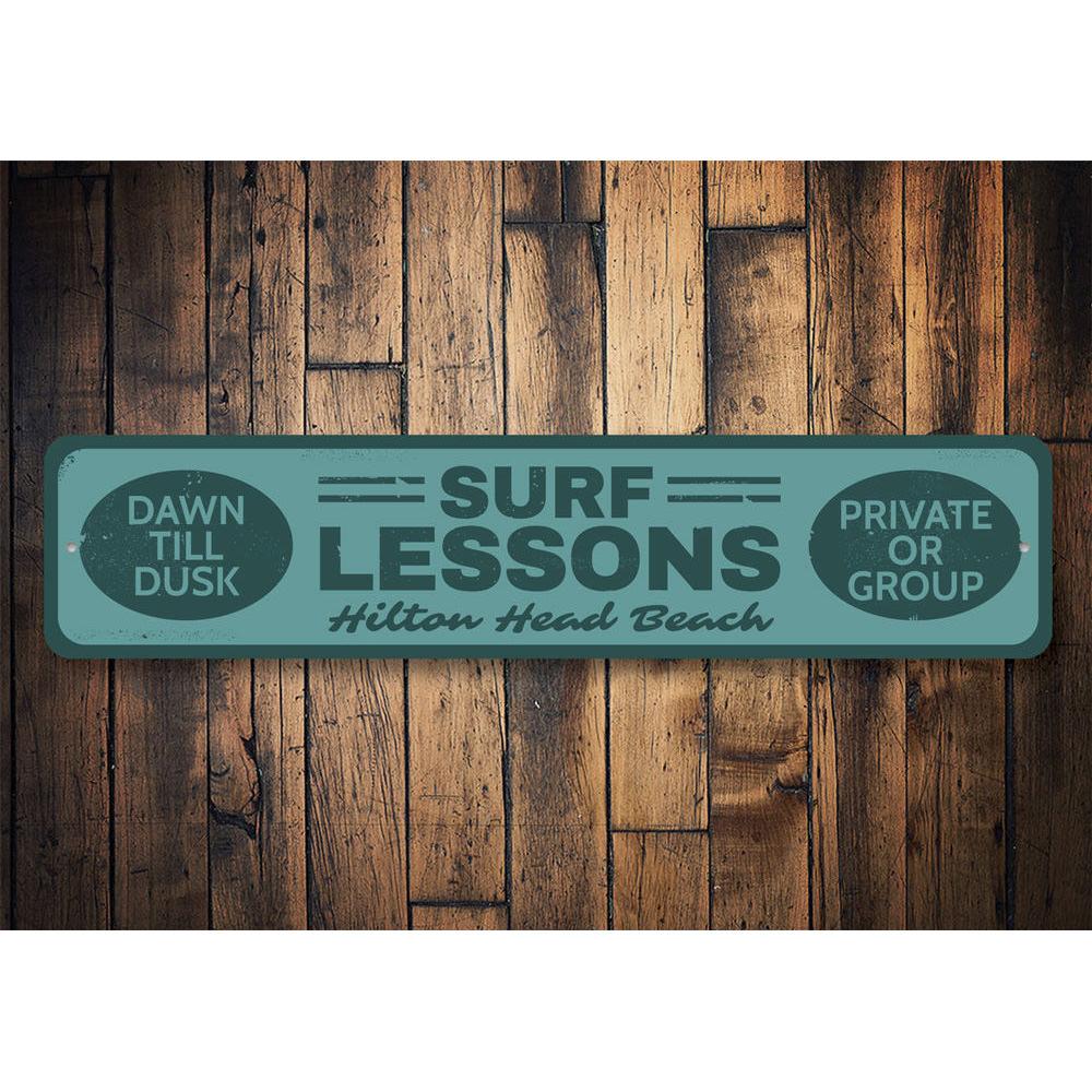 A vibrant Surf Lessons Sign made of high-quality aluminum, featuring customizable text and pre-drilled holes for easy mounting, perfect for beach-themed decor.