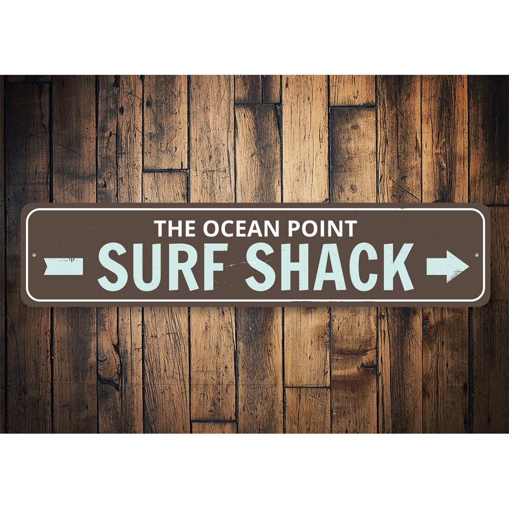 Surf Shack Arrow Sign made of high-quality aluminum, featuring a beach-themed design perfect for coastal decor.