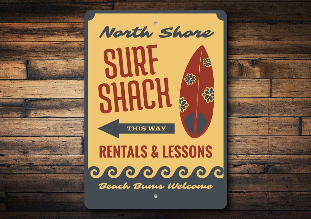 Surf Shack This Way Sign made of aluminum, featuring a beach-themed design, perfect for coastal decor.
