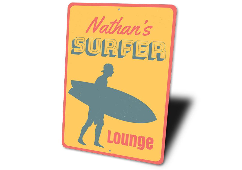 A decorative Surfer Lounge Sign made of high-quality aluminum, featuring a beach-themed design perfect for coastal decor.