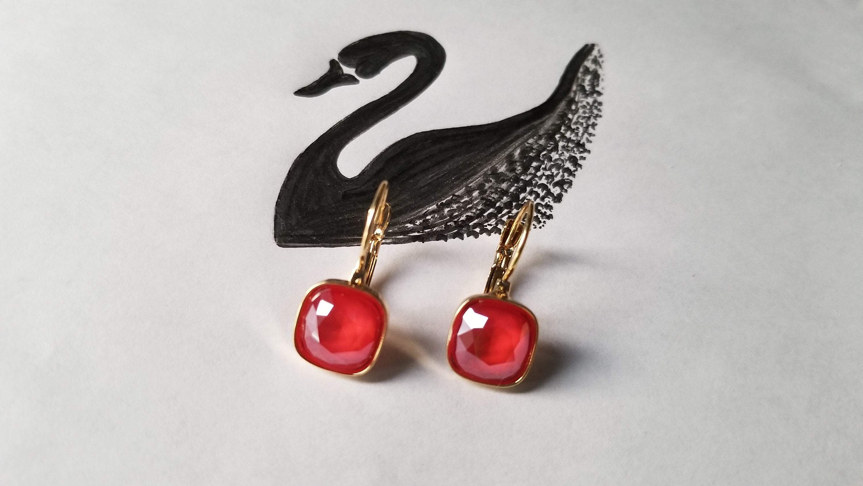 Swarovski Crystal Square Shaped Statement Earrings in Royal Red and Emerald Green, showcasing multifaceted cushion cut crystals.