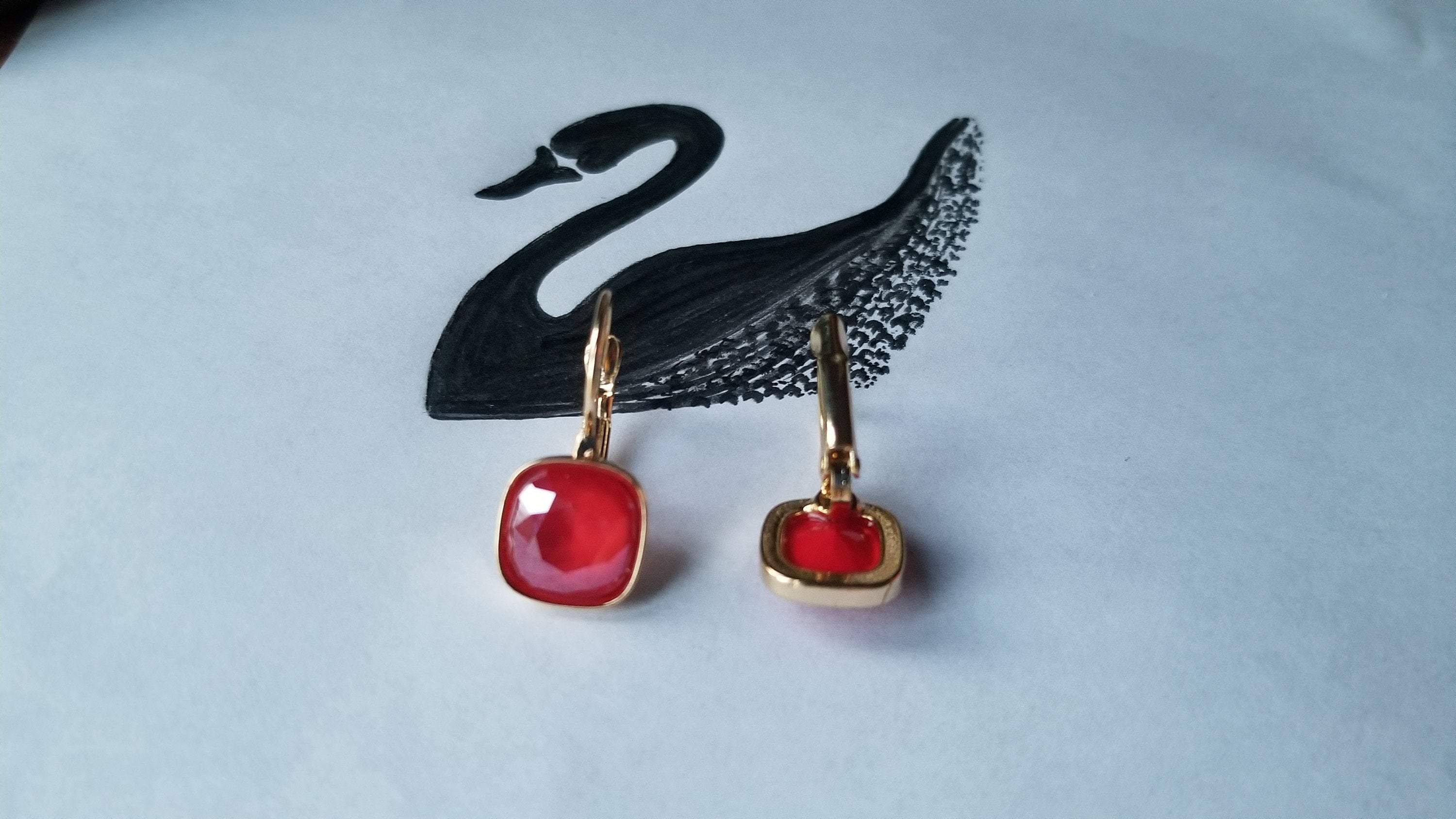 Swarovski Crystal Square Shaped Statement Earrings in Royal Red and Emerald Green, showcasing multifaceted cushion cut crystals.