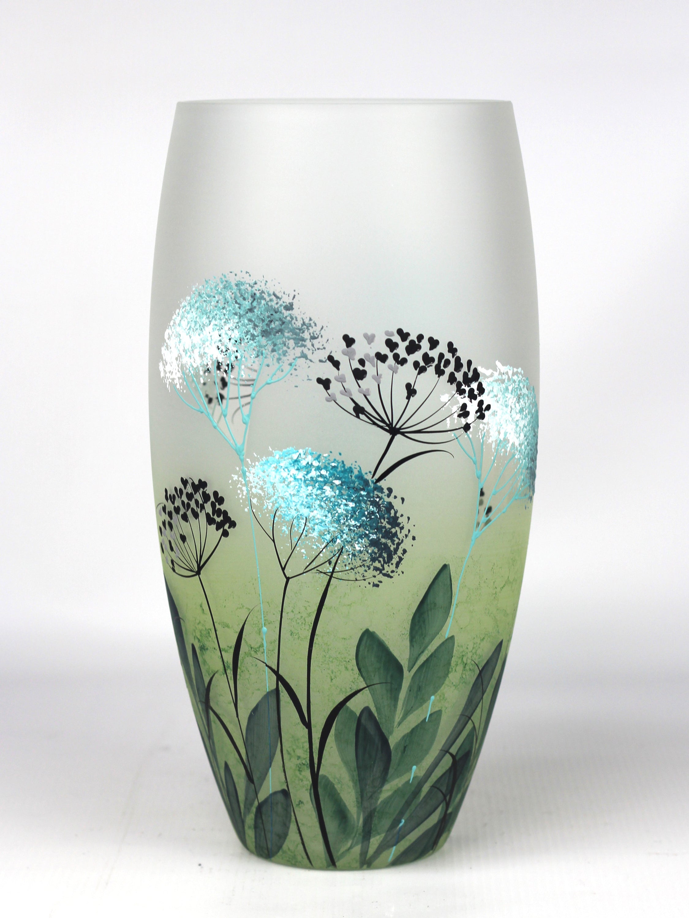 A beautifully hand-painted green decorative glass vase with intricate designs, showcasing unique artistry and craftsmanship.
