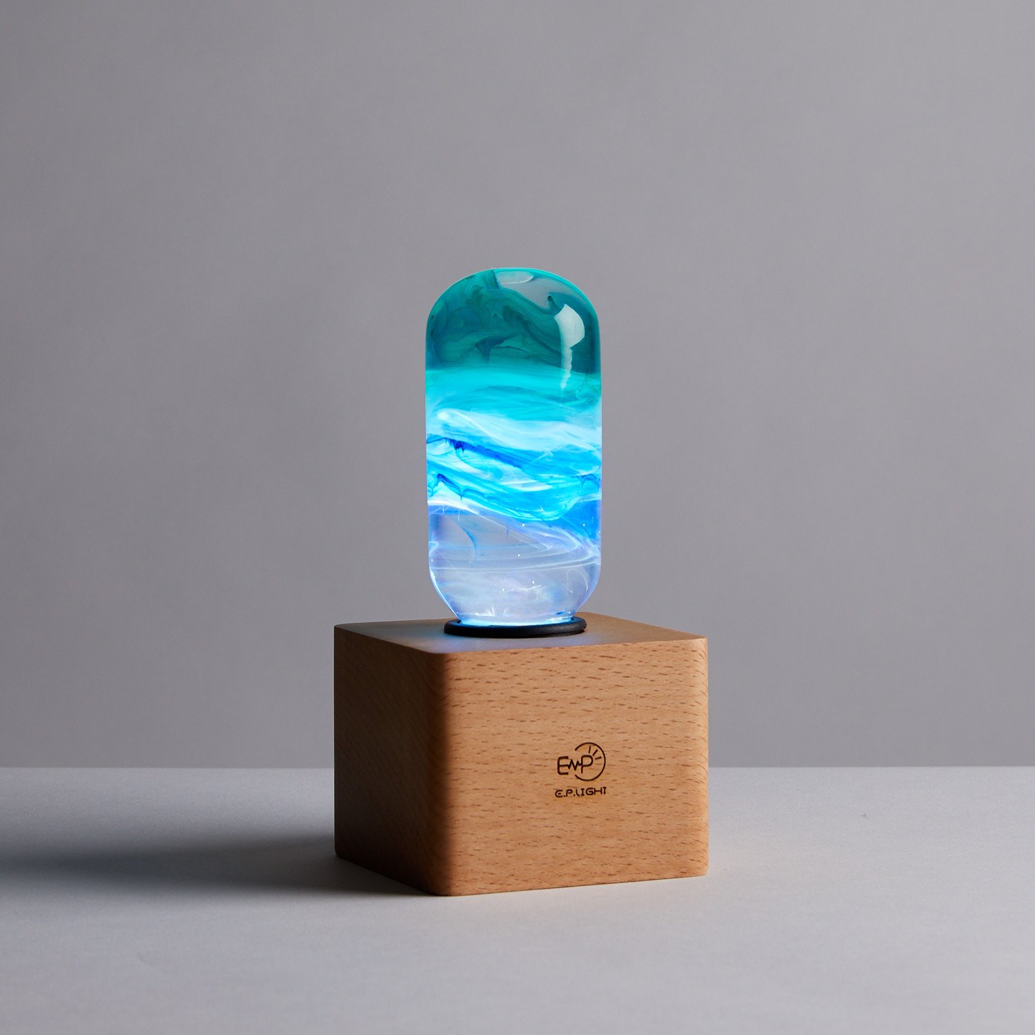 Prairie Table Lamp featuring eco-friendly resin and beech wood, showcasing a mixed color design.