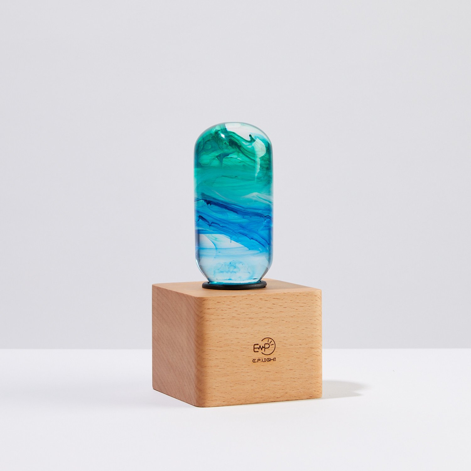 Prairie Table Lamp featuring eco-friendly resin and beech wood, showcasing a mixed color design.