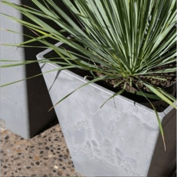 Tall Tapered Square Planter 70cm made from recycled materials with a polished concrete finish, ideal for indoor and outdoor plants.