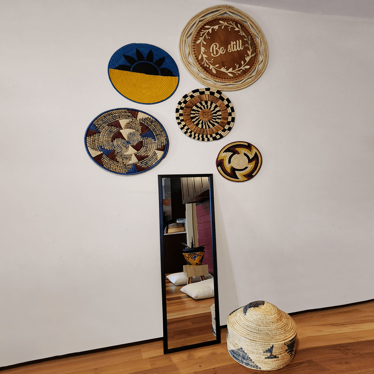 Tanga Handwoven Banana Trivet showcasing authentic African weaving design with vibrant colors and intricate patterns.