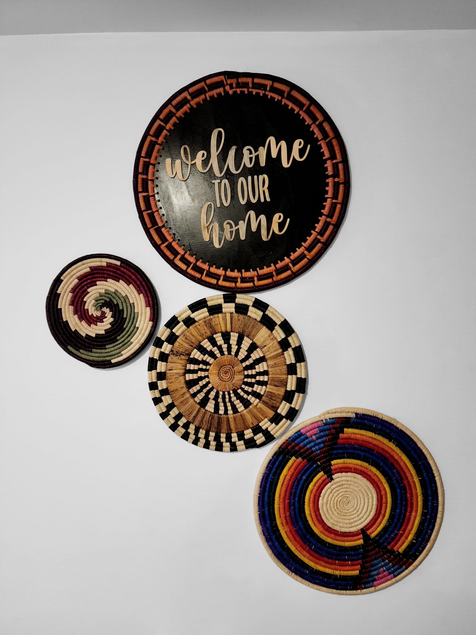 Tanga Handwoven Banana Trivet showcasing authentic African weaving design with vibrant colors and intricate patterns.