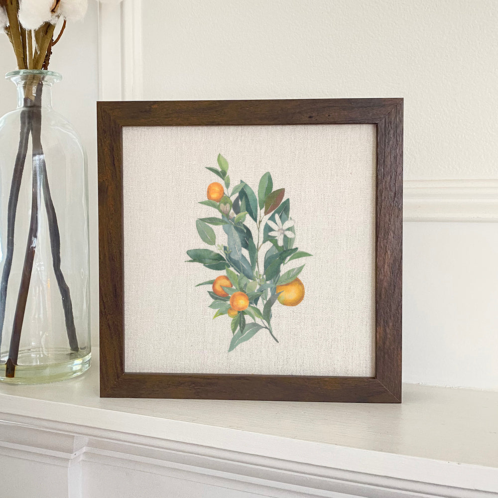 Tangerine Branch Framed Sign with a wood frame, eco-friendly ink printing, and a linen-look neutral background.