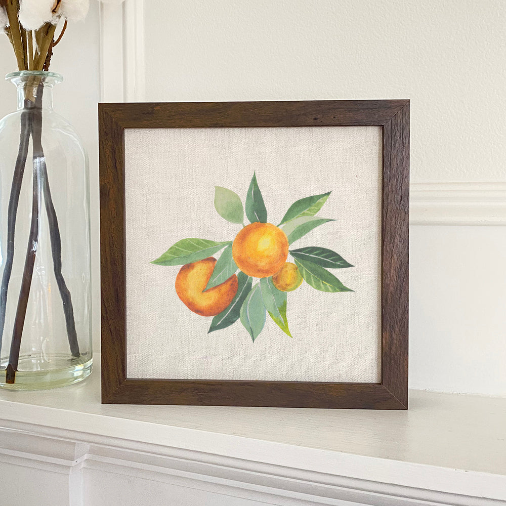 Tangerine Bunch framed sign with a wood frame, eco-friendly inks, and a linen-look background, displayed on a shelf.