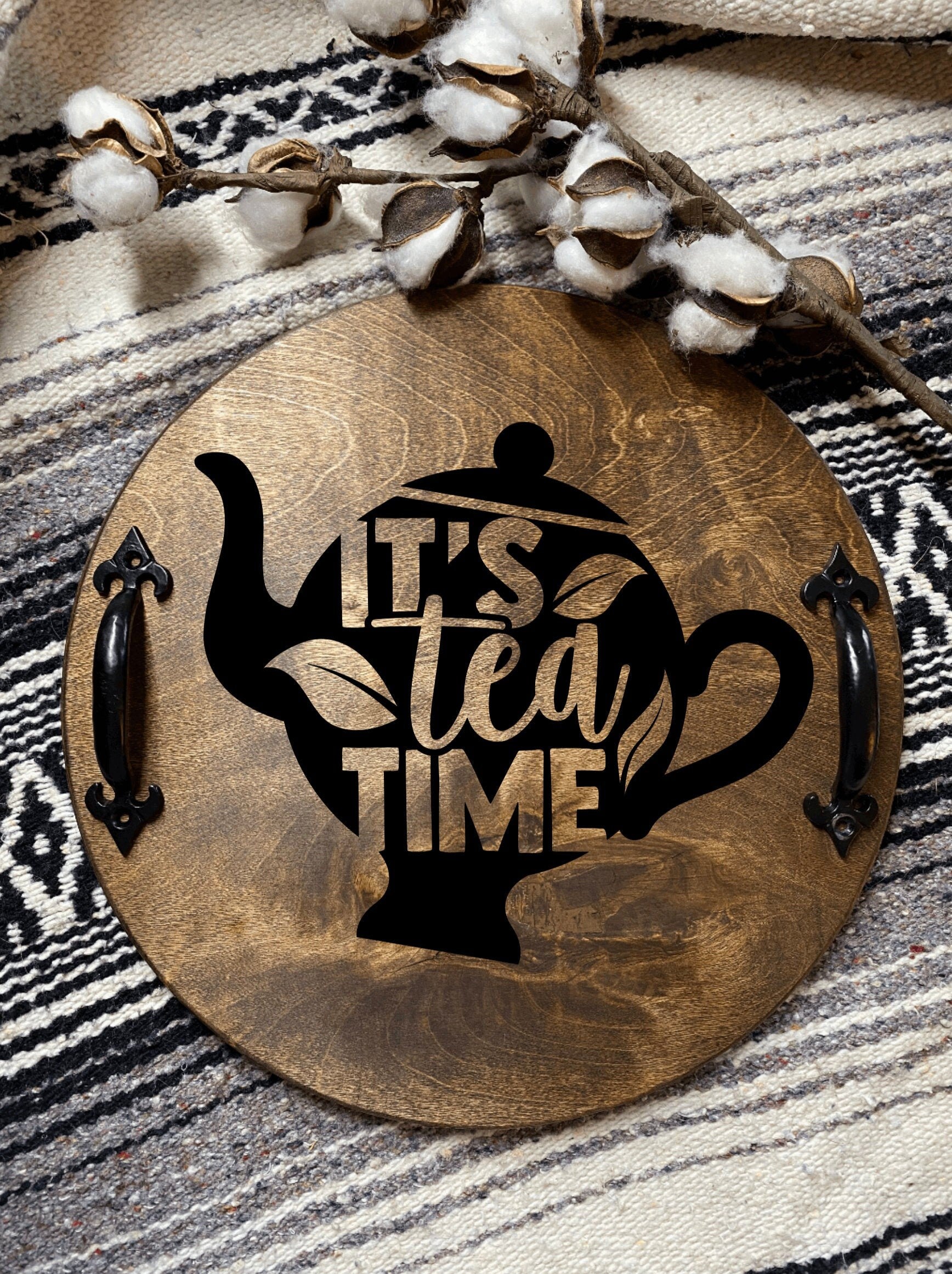 Handmade wooden serving tray with black metal handles, stained in dark chestnut color, showcasing unique wood grain patterns.