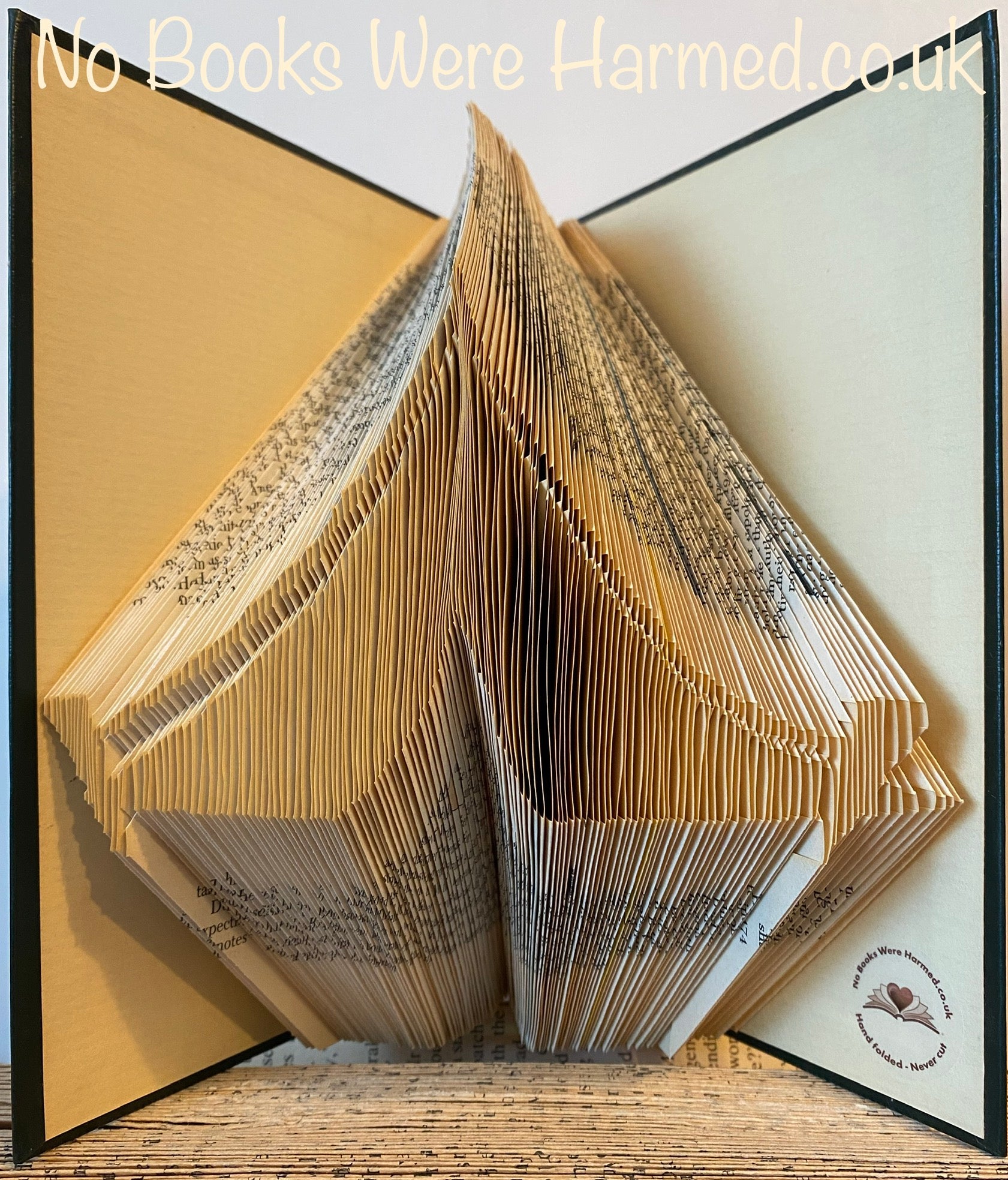 A unique hand-folded canvas camping tent made from reclaimed materials, showcasing its artistic design and eco-friendly craftsmanship.