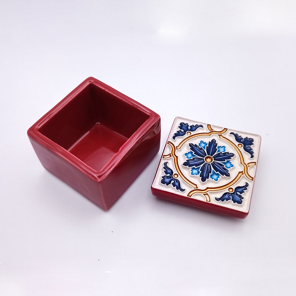 A beautifully handcrafted ceramic box from Terceira Island, showcasing intricate designs and vibrant colors, perfect for decor or storage.