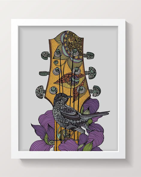 A vibrant print of 'The Bird and the Guitar', showcasing colorful artwork featuring a bird and a guitar, ready for framing.