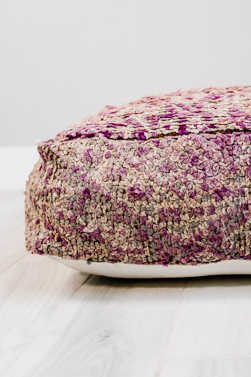 A vibrant 28x28 Berber pillow made from a vintage purple rug, showcasing intricate patterns and rich colors, perfect for home decor.