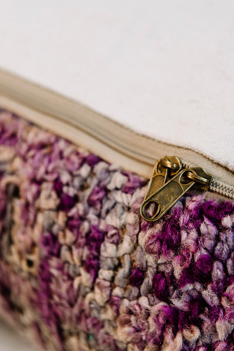 A vibrant 28x28 Berber pillow made from a vintage purple rug, showcasing intricate patterns and rich colors, perfect for home decor.