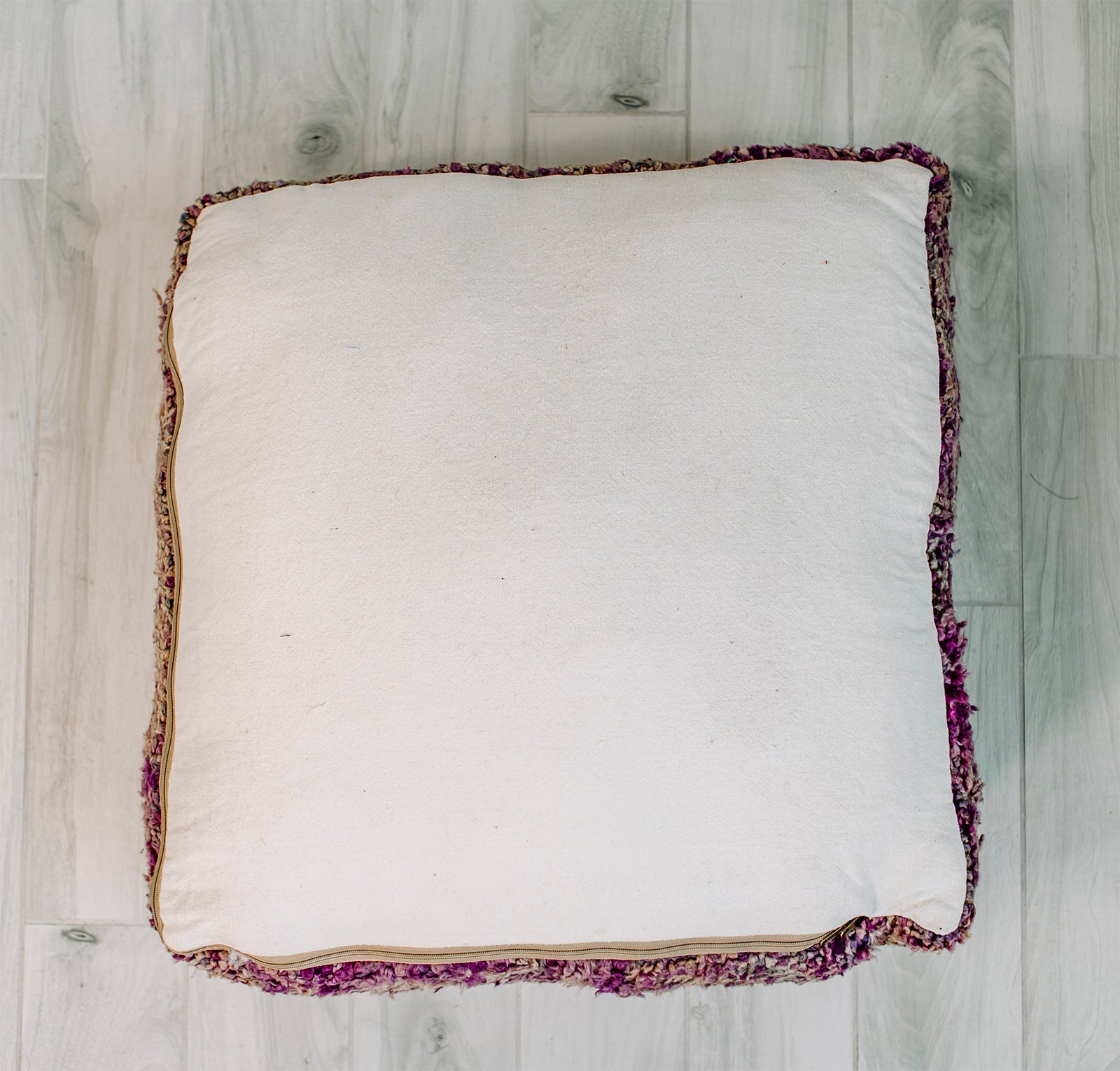 A vibrant 28x28 Berber pillow made from a vintage purple rug, showcasing intricate patterns and rich colors, perfect for home decor.