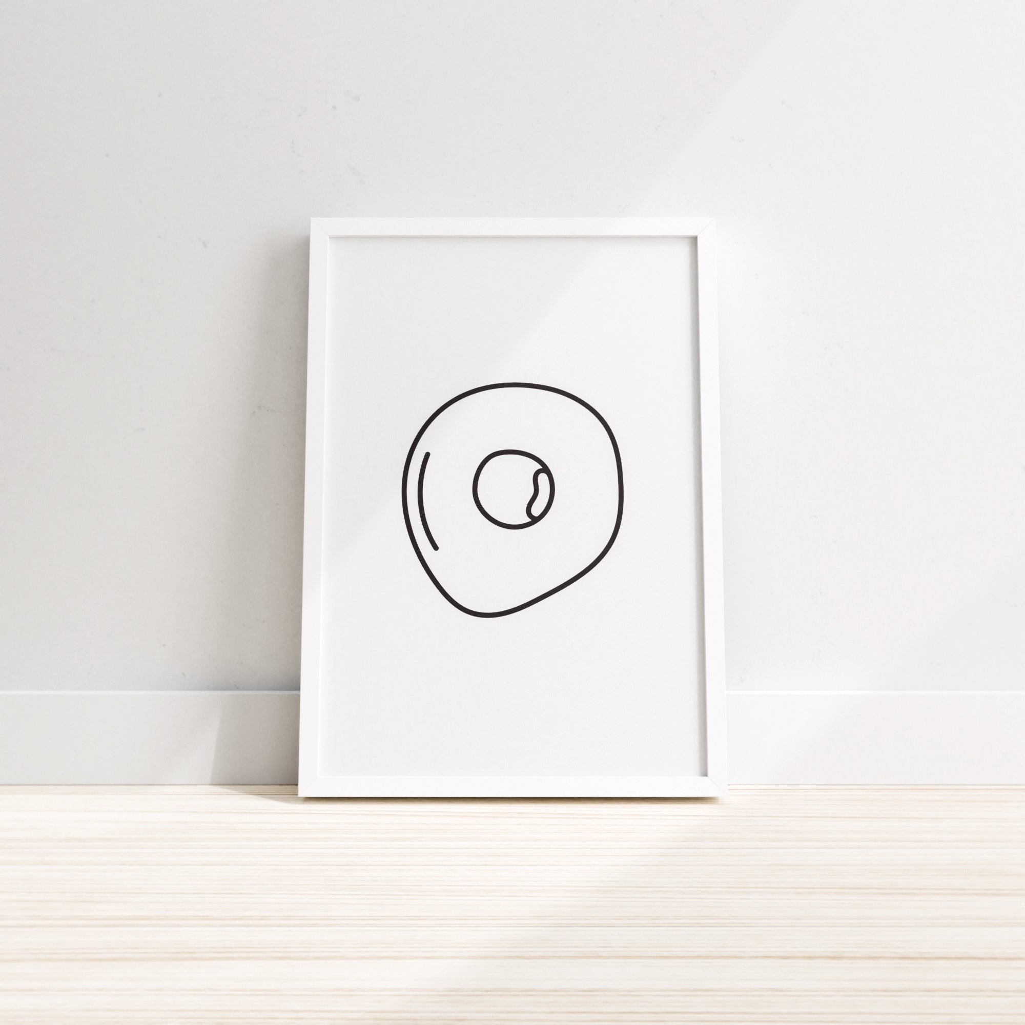 A vibrant wall print featuring a fried egg design, perfect for kitchen decor.