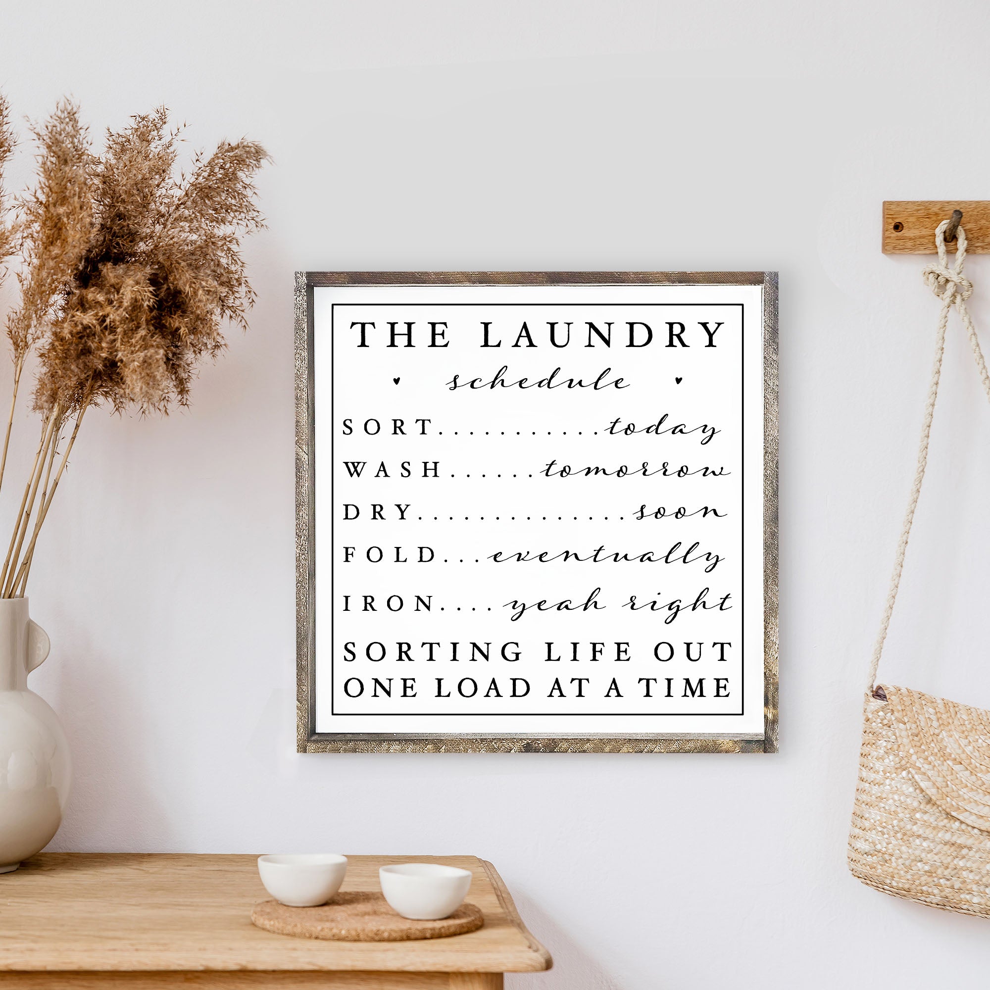 Humorous laundry schedule sign.