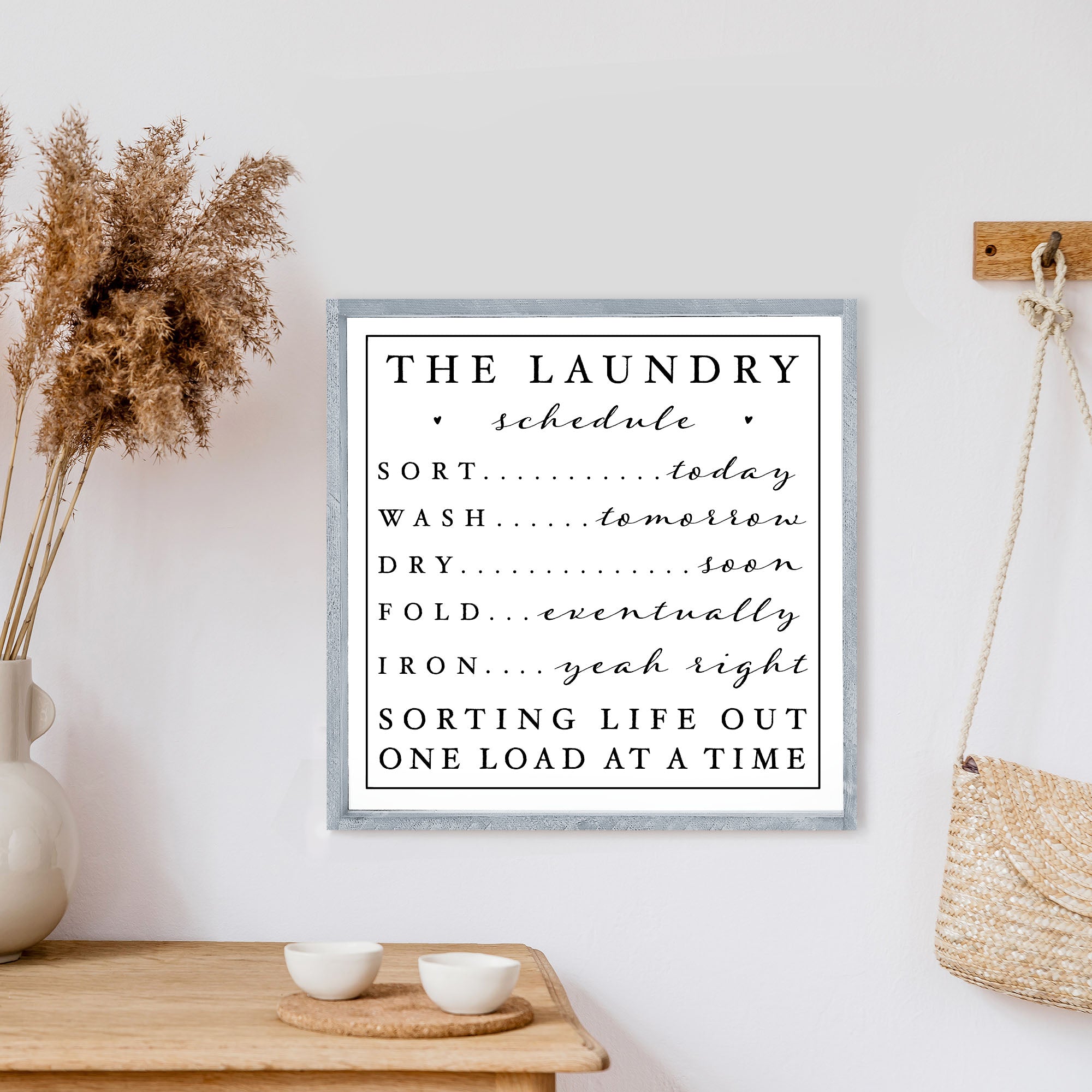 "The Laundry Schedule" humorous sign.