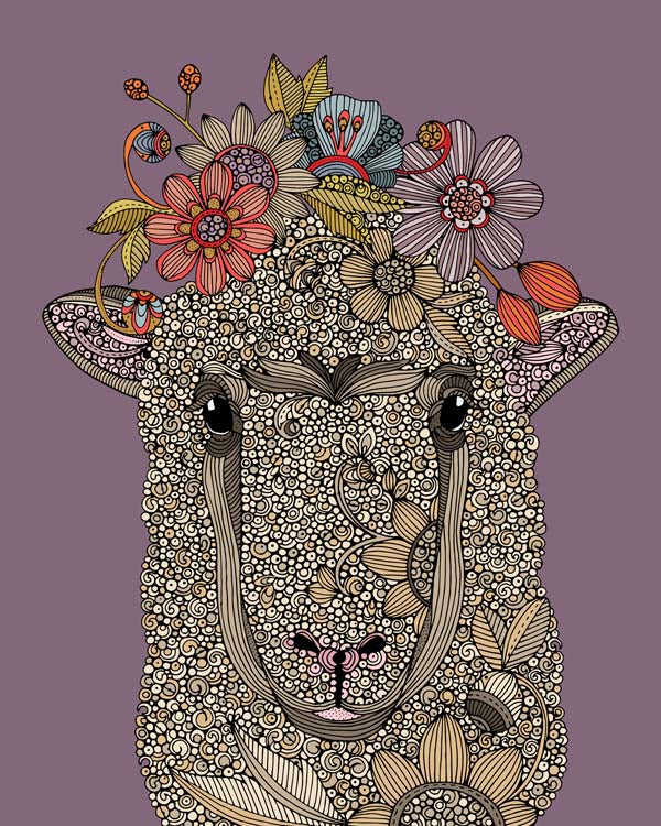 Artwork of a sheep surrounded by colorful flowers on photographic paper.