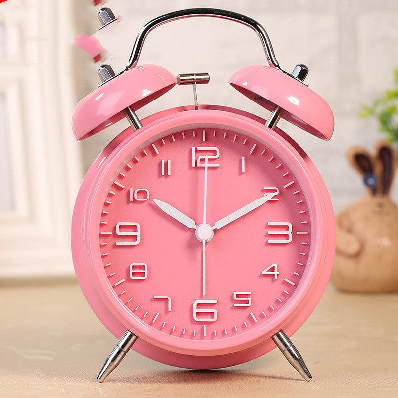 Three-dimensional digital alarm clock with a round design, luminous display, and metal shell, perfect for stylish home decor.