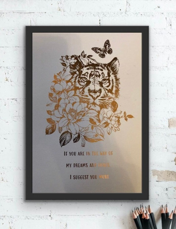 A beautiful foil print featuring a tiger in rose gold on a white background with an inspiring quote about dreams and goals.