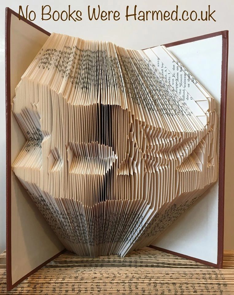 Hand-folded book art featuring Clydesdale and Gypsy Cob horses, showcasing intricate designs from vintage pages.