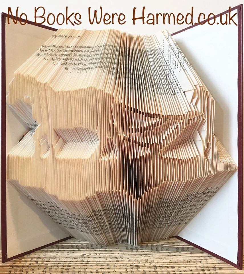 Hand-folded book art featuring Clydesdale and Gypsy Cob horses, showcasing intricate designs from vintage pages.