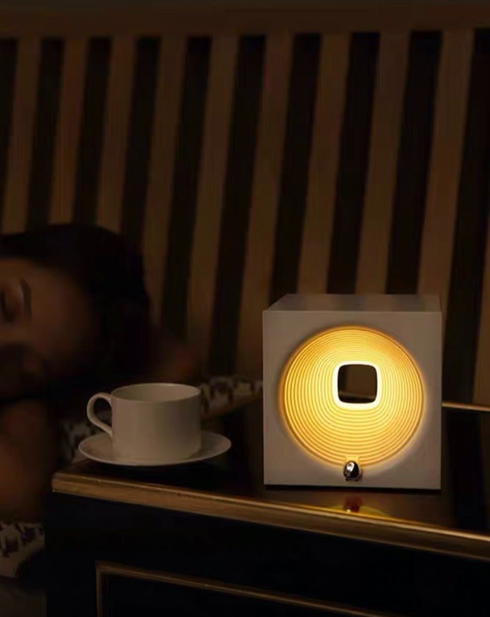 Time Machine Sleep Inducing Bedside Lamp with a futuristic design, featuring a soft glow and built-in speaker for soothing sounds.