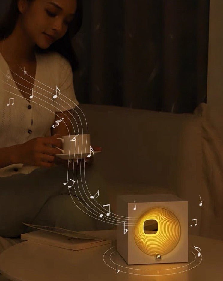 Time Machine Sleep Inducing Bedside Lamp with a futuristic design, featuring a soft glow and built-in speaker for soothing sounds.