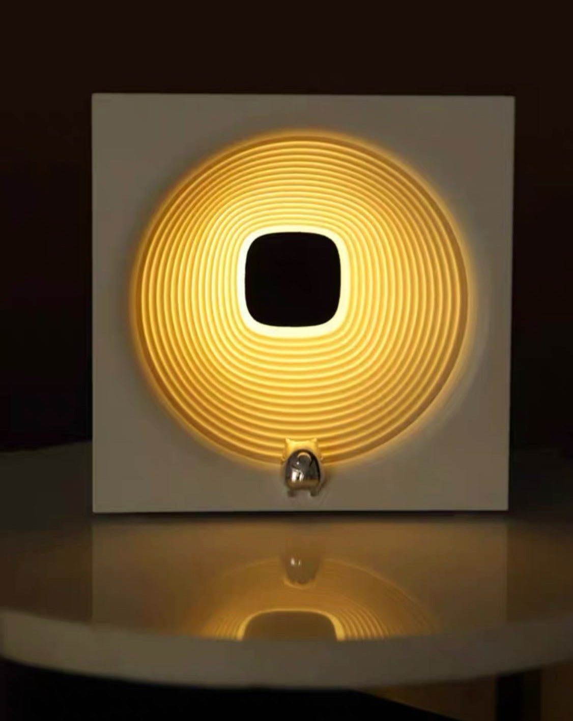 Time Machine Sleep Inducing Bedside Lamp with a futuristic design, featuring a soft glow and built-in speaker for soothing sounds.