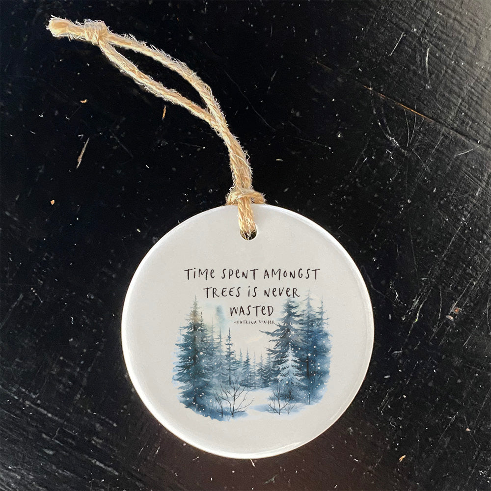 A beautifully crafted porcelain ornament featuring a unique design inspired by nature, measuring 2.75 inches in diameter.