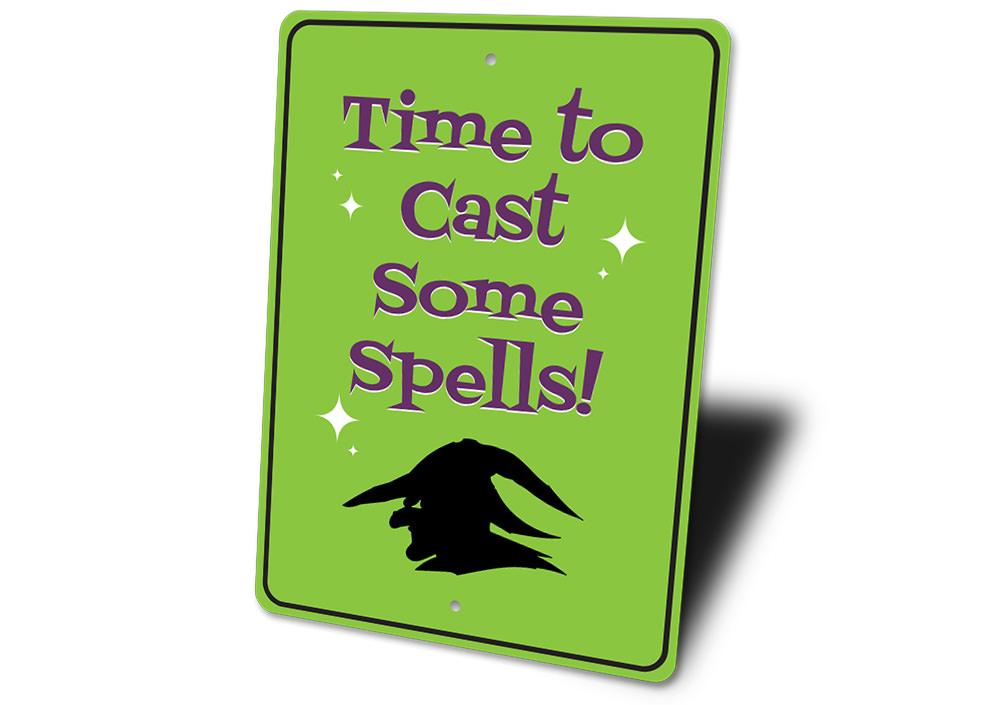 A decorative metal sign reading 'Time to Cast Some Spells', perfect for Halloween decor, featuring spooky design elements.