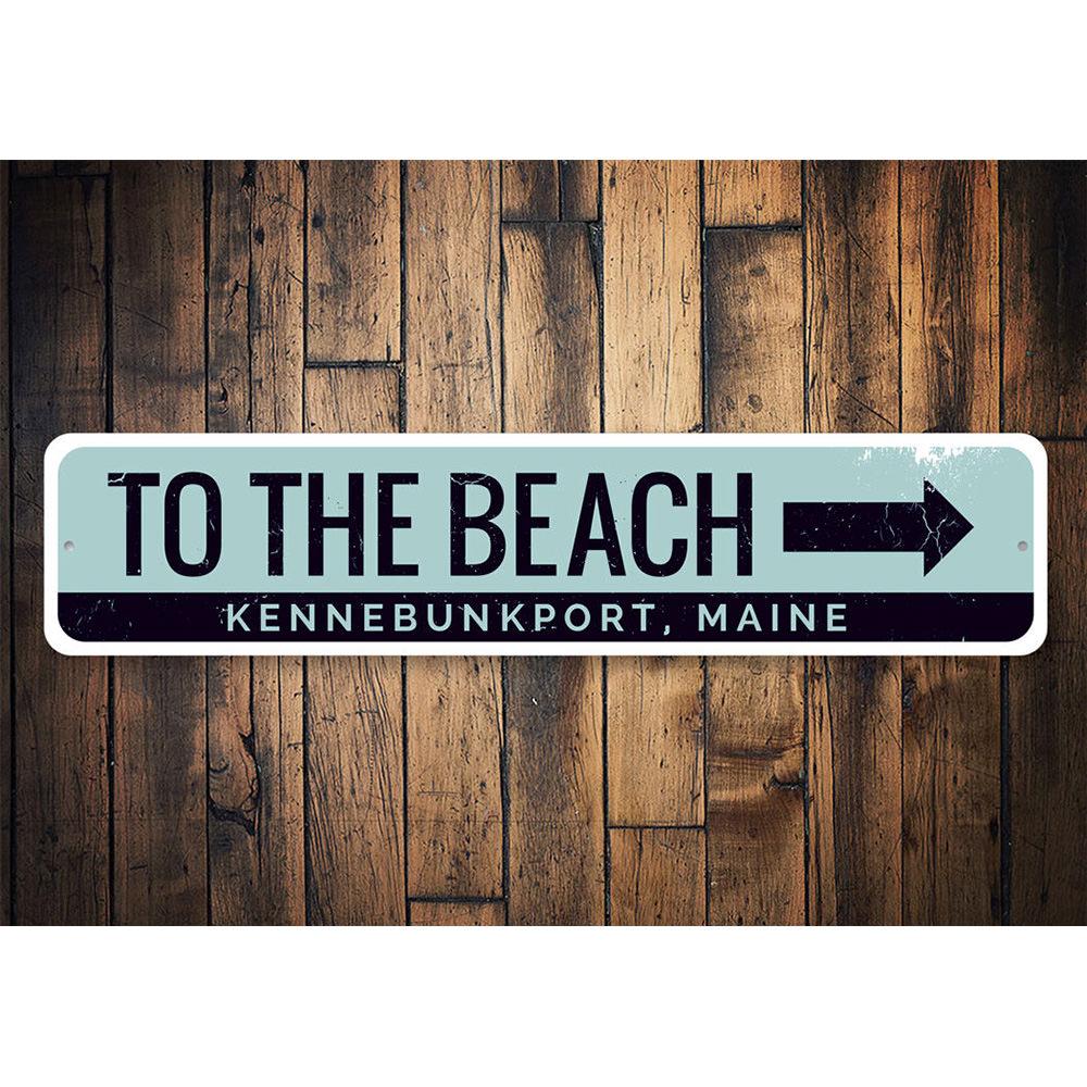 A decorative 'To the Beach' sign made of high-quality aluminum, featuring vibrant colors and customizable text, perfect for coastal decor.