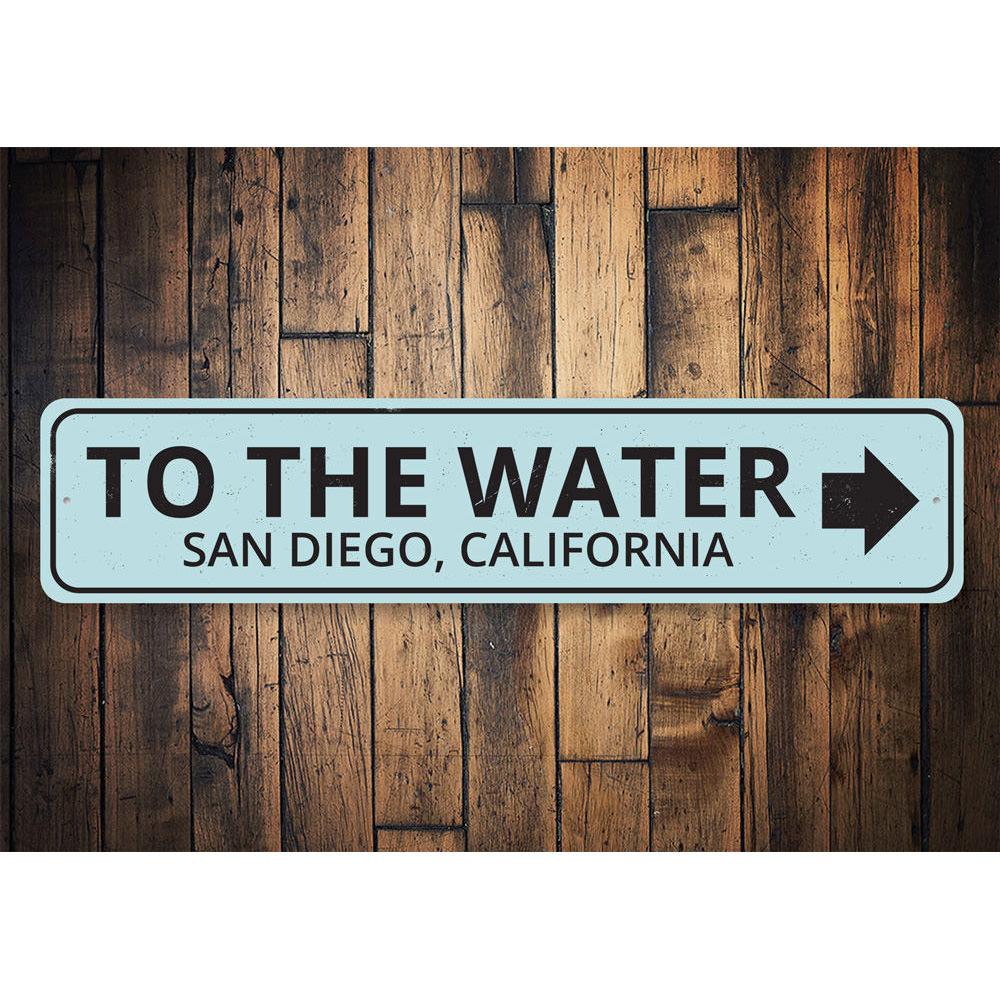 To the Water Arrow Sign made of high-quality aluminum, featuring a coastal design perfect for beach houses and outdoor decor.