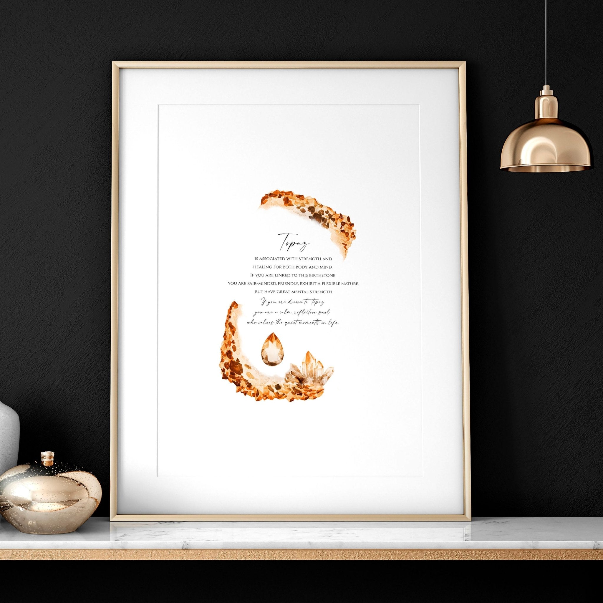 Framed wall art print featuring the Topaz birthstone in warm golden-brown hues, showcasing its shimmering facets and radiant glow.