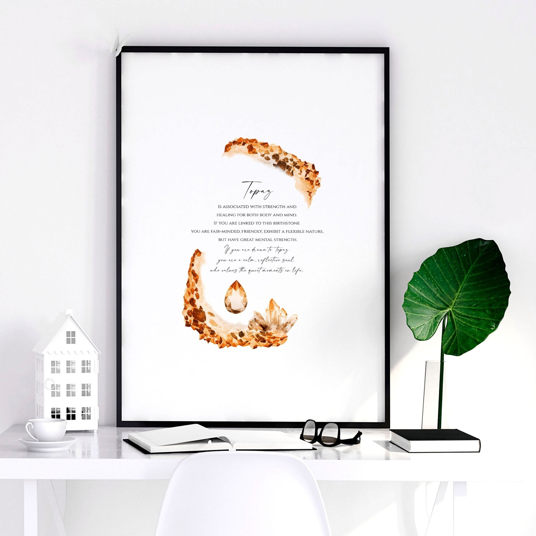 Framed wall art print featuring the Topaz birthstone in warm golden-brown hues, showcasing its shimmering facets and radiant glow.