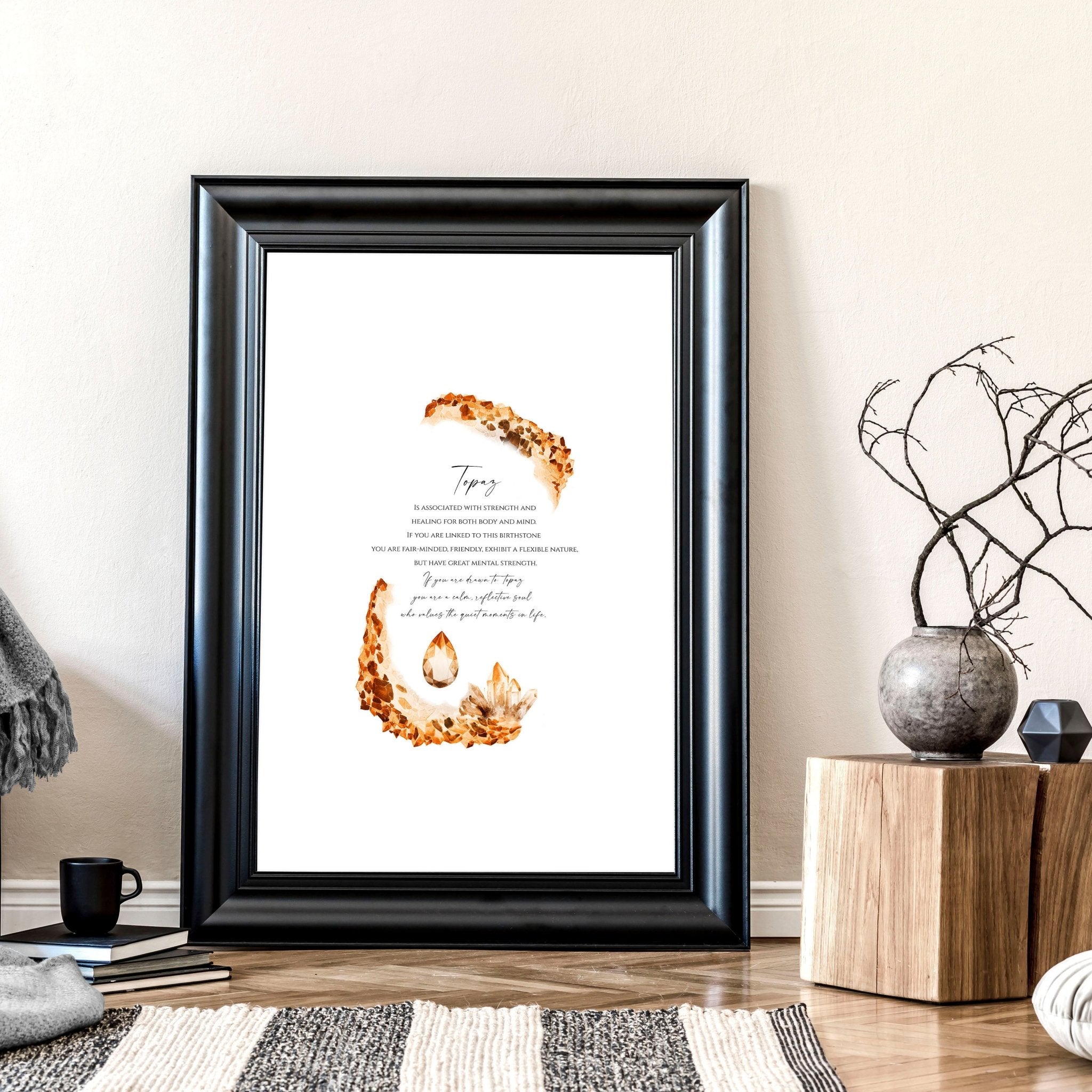 Framed wall art print featuring the Topaz birthstone in warm golden-brown hues, showcasing its shimmering facets and radiant glow.