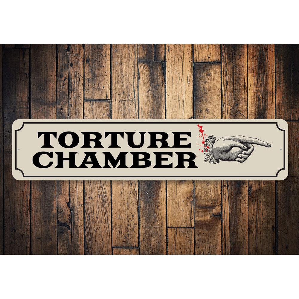 Torture Chamber Sign featuring spooky design, made from durable aluminum, perfect for Halloween decorations.