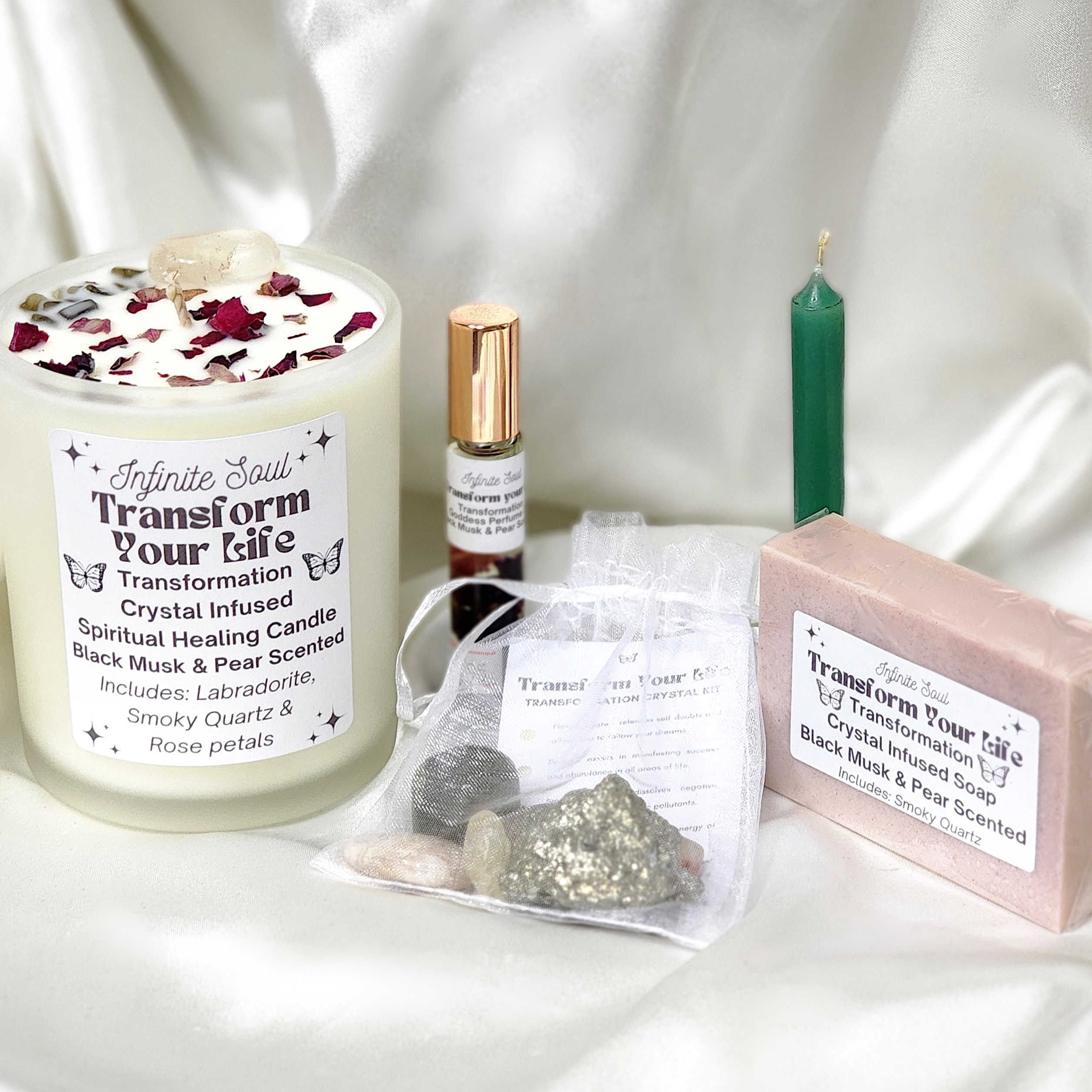 Transformation Bundle featuring crystal healing kit, scented body oil, candle, and bracelet for emotional healing.