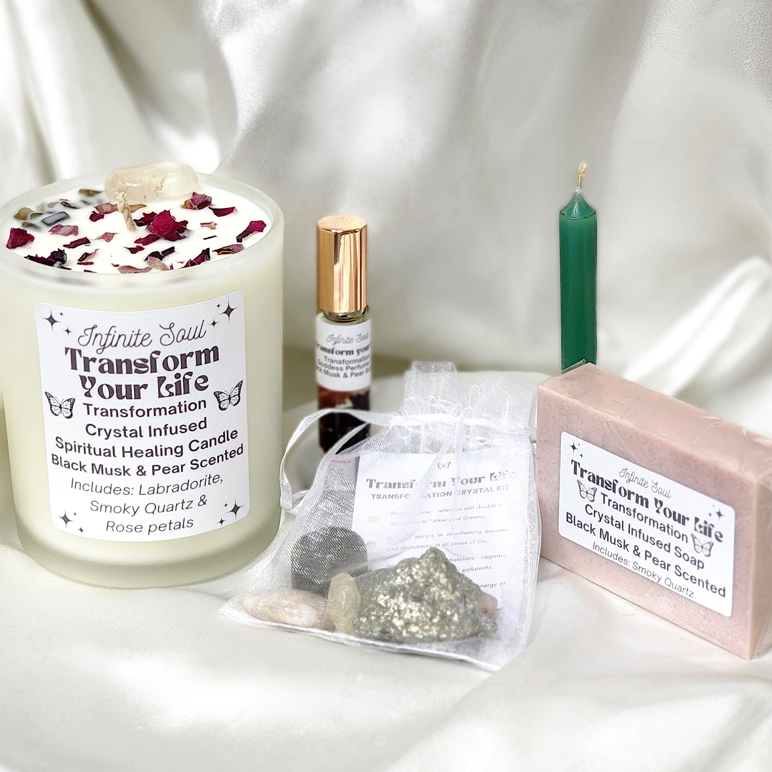 Transformation Bundle featuring crystal healing kit, scented body oil, candle, and bracelet for emotional healing.
