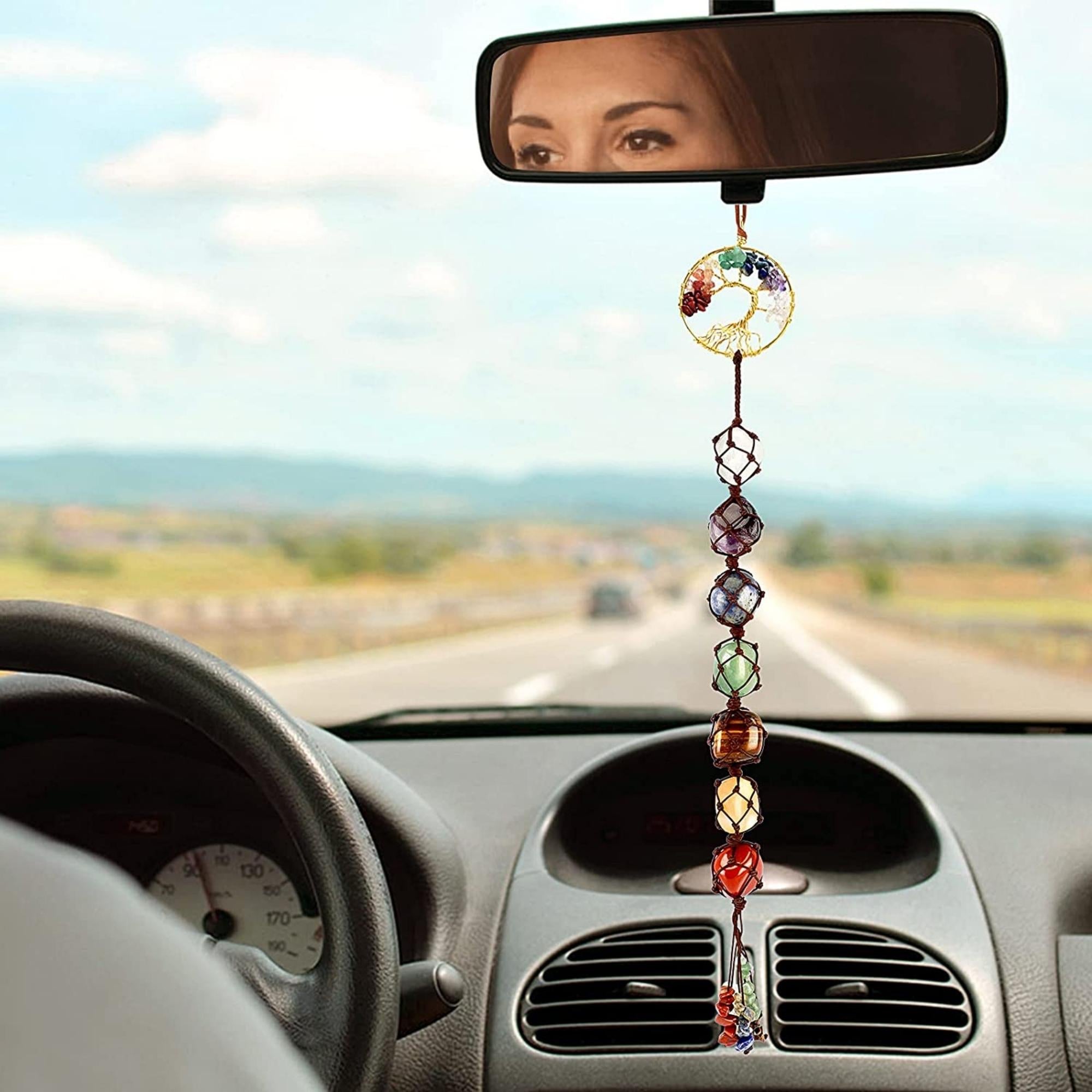 A beautifully crafted Tree of Life ornament featuring seven chakra healing crystals, symbolizing growth and positive energy.