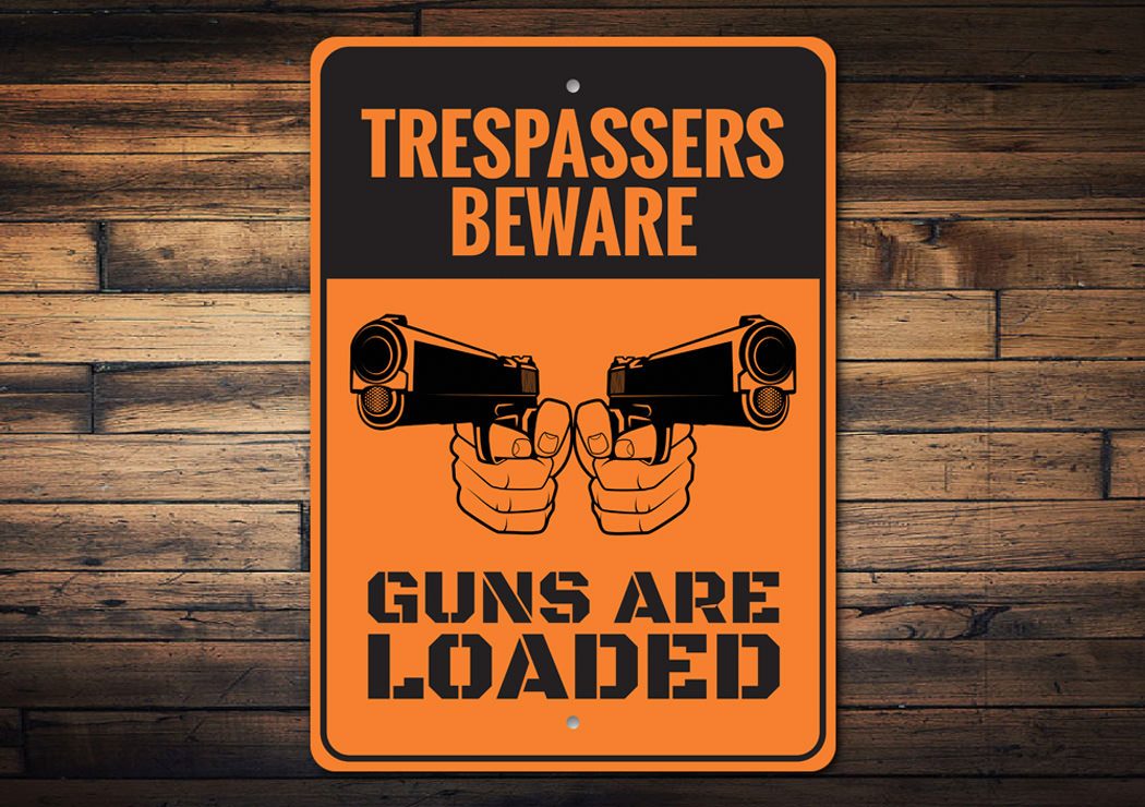 Trespassers Beware Guns are Loaded Sign made of durable aluminum, featuring a bold warning message, ideal for outdoor use.