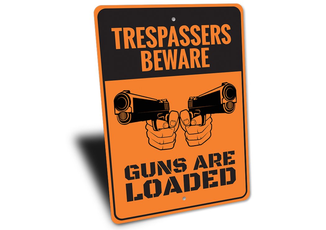 Trespassers Beware Guns are Loaded Sign made of durable aluminum, featuring a bold warning message, ideal for outdoor use.