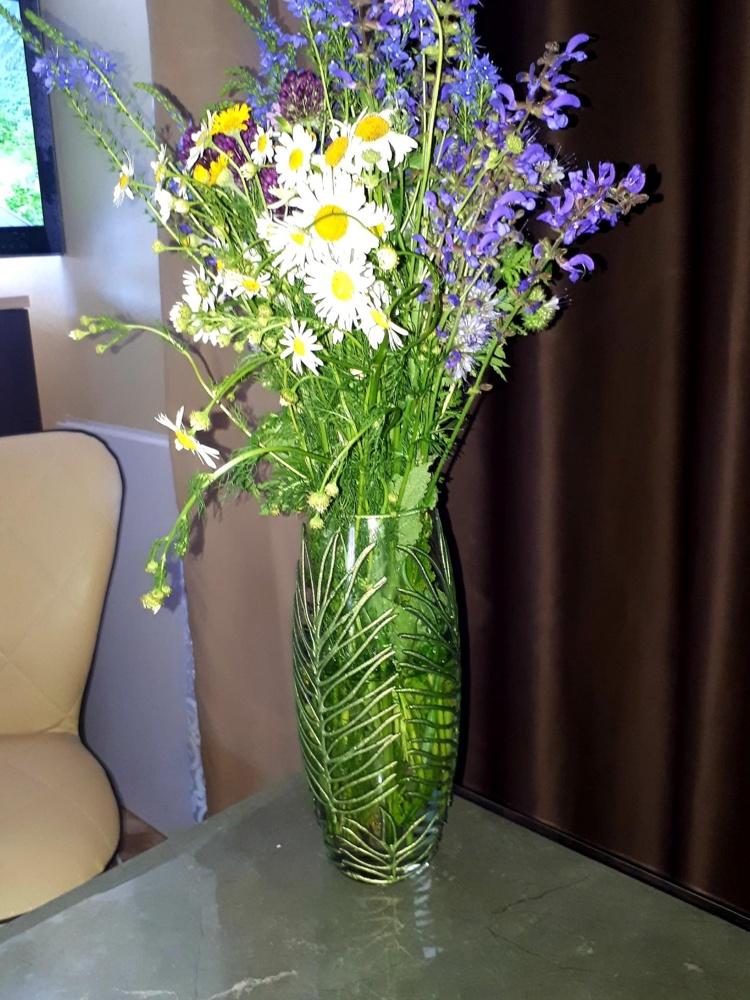 A beautifully hand-painted Tropical Art Glass Oval Vase featuring vibrant colors and intricate designs, perfect for floral arrangements.