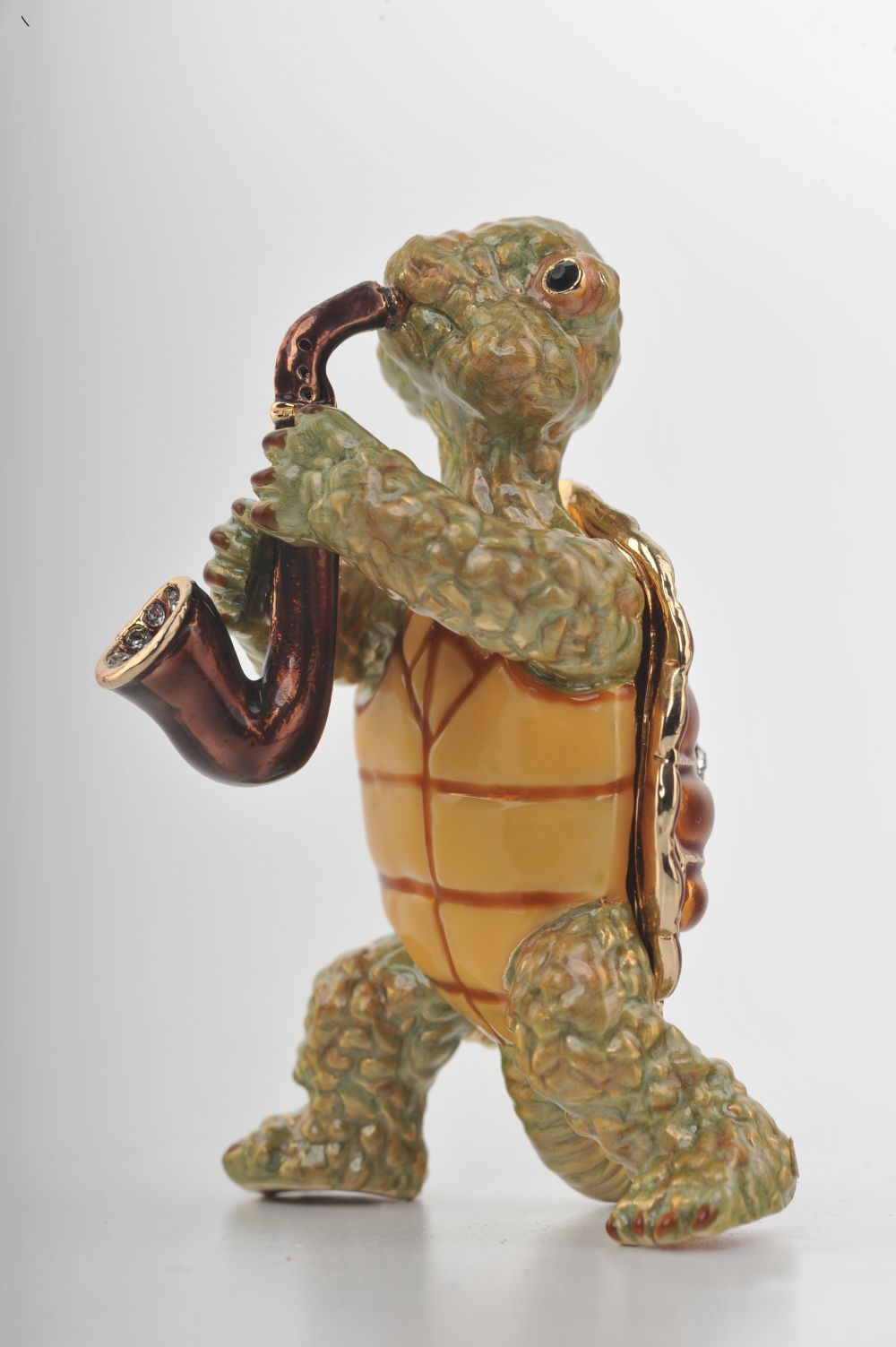 Handmade trinket box featuring a turtle playing the saxophone, adorned with Austrian crystals and 24K gold plating.
