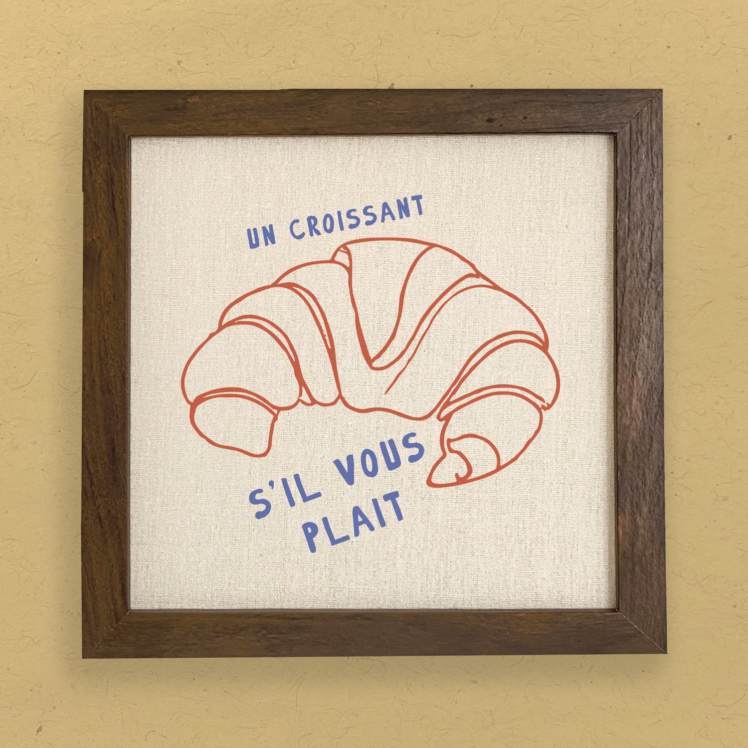 Un Croissant framed sign with a stylish wood frame, featuring eco-friendly ink printing on a linen-look background.