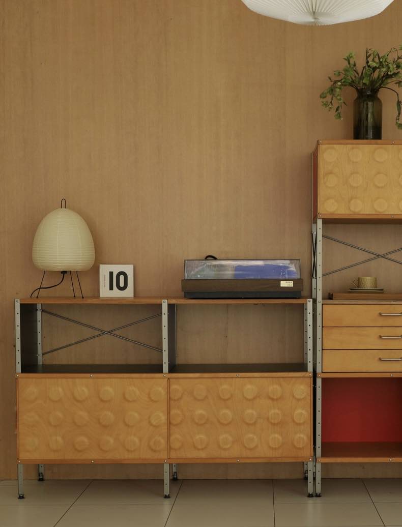 Wabi Sabi Table Lamp featuring handmade washi paper and bamboo ribbing, casting a warm glow.