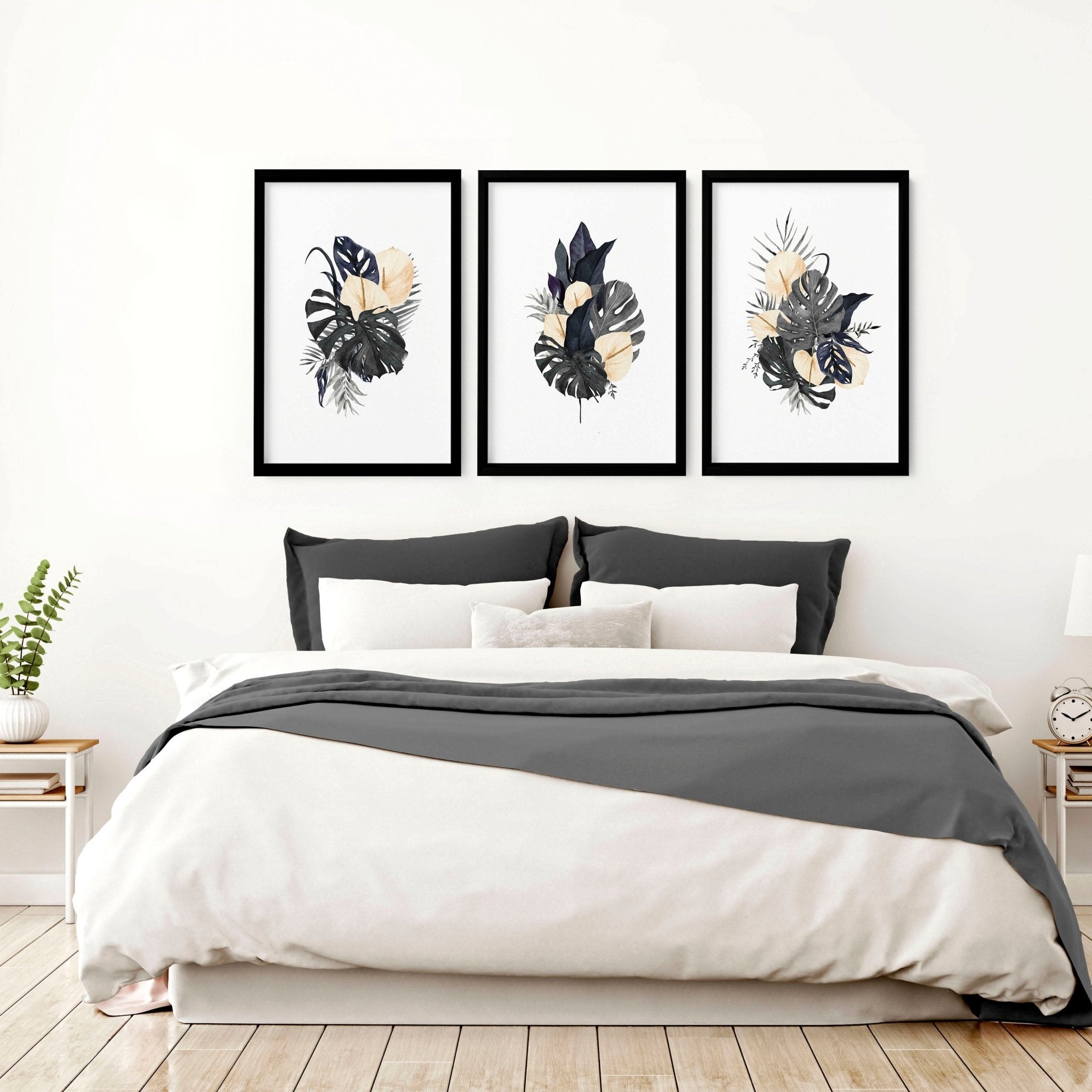 Set of 3 framed wall art prints featuring tropical Monstera leaves and pink flowers, perfect for bedroom decor.